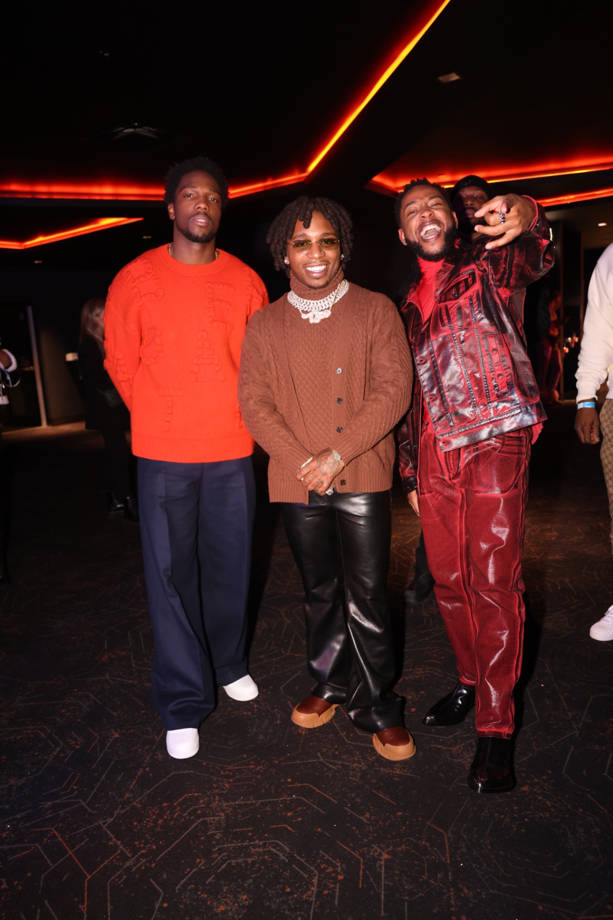 Group of friends celebrating at a private premiere lounge