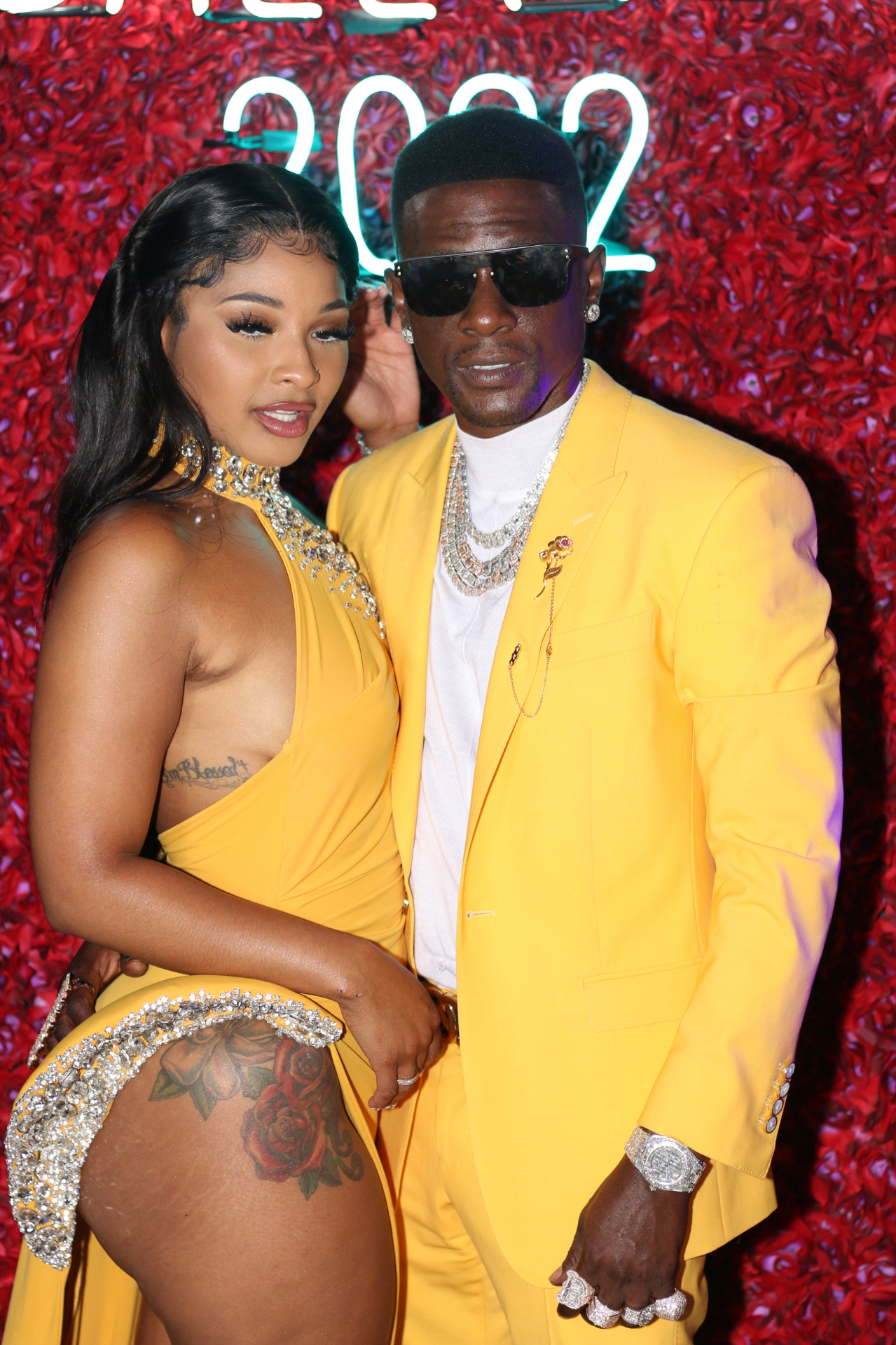 Couple in yellow on the red rose carpet at a ball